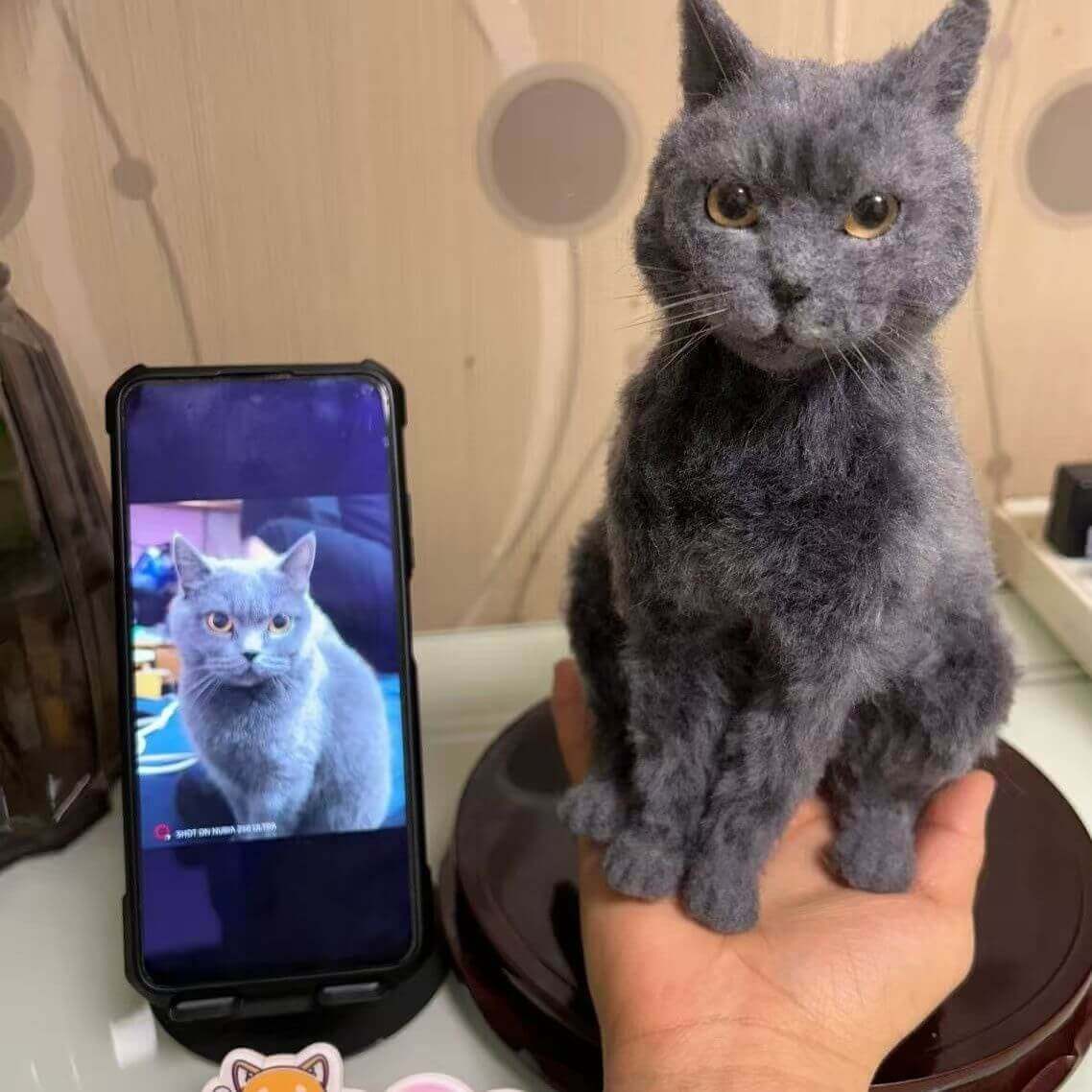 Custom gray cat memorial plush cuddle clone shown beside original cat photo