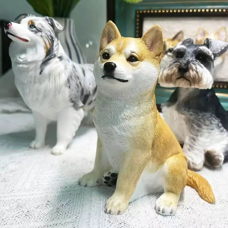 Four different small pets, including cats and dogs, with their custom plush clones.